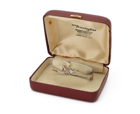 Diamond set bangle, in unmarked yellow metal, circa 1900, the two principal old brilliant cuts estimated as totalling approxi