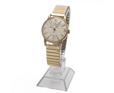 Gentleman's vintage Smiths De Luxe shockproof 9ct gold wristwatch, c1950s. 9ct Gold 30mm case, manual wind, silver textured d