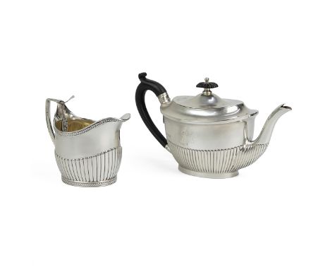 Victorian teapot with semi-reeded decoration and ebony finial, London 1891, along with a George III silver cream jug, London 
