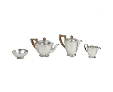 Silver four piece tea set of classical form, comprising a teapot, water/coffee pot both with bakelite handles and finials, su