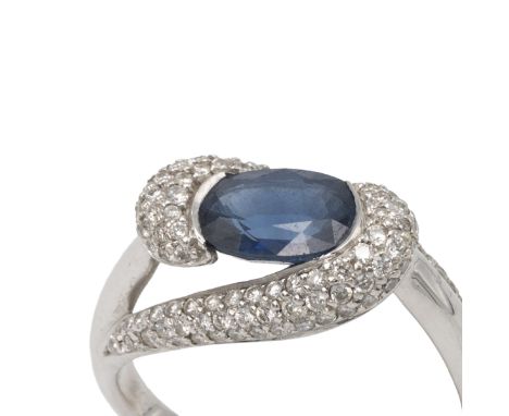Sapphire and diamond dress ring, the white mount stamped &lsquo;750&rsquo;, the oval cut between sweeping pave set shoulders,