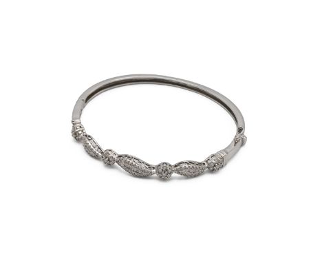 Diamond set bangle, the white metal stamped &rsquo;14K&rsquo;, set with small brilliant, single and baguette-cut diamonds, in