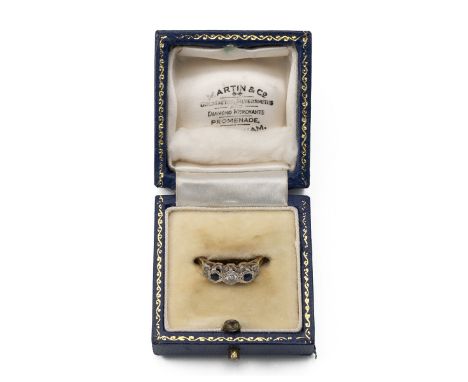 Three stone diamond and sapphire ring, the illusion set stones to an unmarked yellow metal mount, finger size R, 3.8 grams.