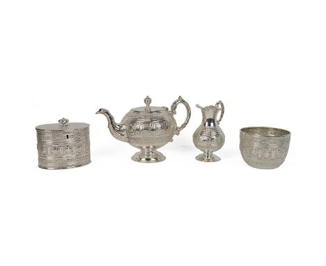 Victorian four-piece silver tea service, comprising teapot, tea caddy, milk jug, and sugar bowl, with a central band of the z