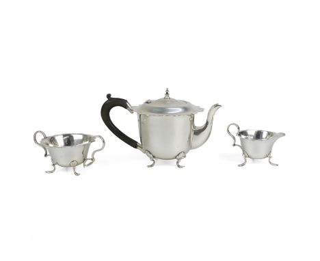 Silver three piece tea set, comprising teapot, sugar bowl and milk jug, all with pie crust rim all raised on cabriole lion pa