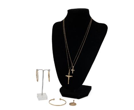 An assortment of 9ct gold hallmarked jewellery including two crucifixes and chains, earrings, a bangle and a St Christopher, 