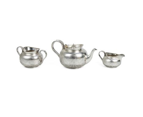 Victorian silver three piece tea set highly decorated to the body, with raised beaded rims, comprising teapot, sugar bowl and