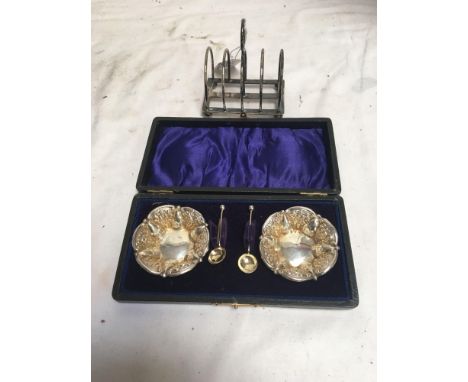  Sale Item:    SILVER TOAST RACK &amp; CASED SILVER SALTS  Vat Status:   No Vat   Buyers Premium:  This lot is subject to a B