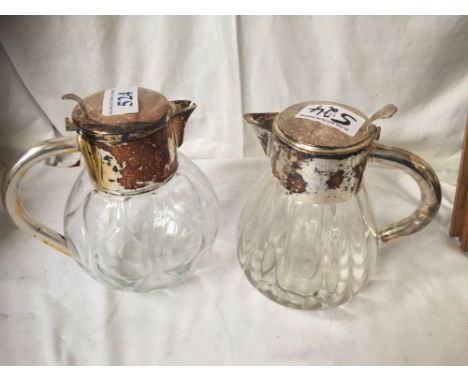  Sale Item:    2 E P TOPPED JUGS   Vat Status:   No Vat   Buyers Premium:  This lot is subject to a Buyers Premium of 15% + V