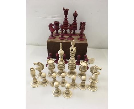 Antique Carved bone Chess Set White pieces all look in good condition and are complete the red have damage to the kings crown