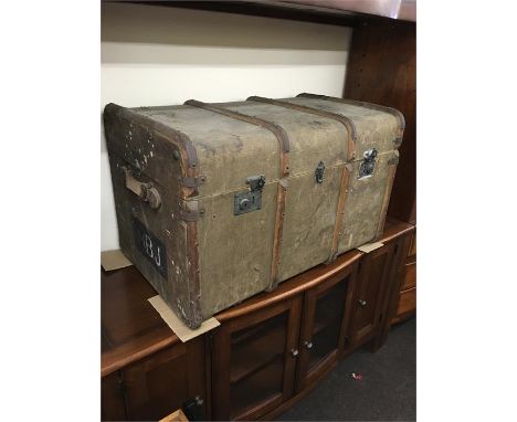 Antique wood bound traveling trunk 