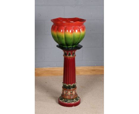 20th Century Majolica jardiniere on associated stand, the green and red glazed jardiniere with marks to the base, 690 K and a