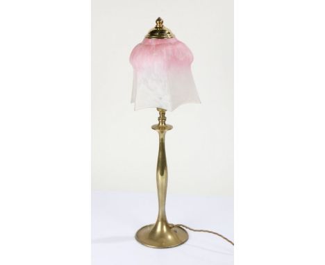 Brass table lamp with a shaped mottled glass shade in pink and white, 54cm high