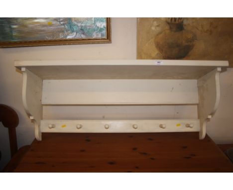 A white painted wall shelf 