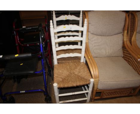 A pair of white painted ladder back dining chairs 