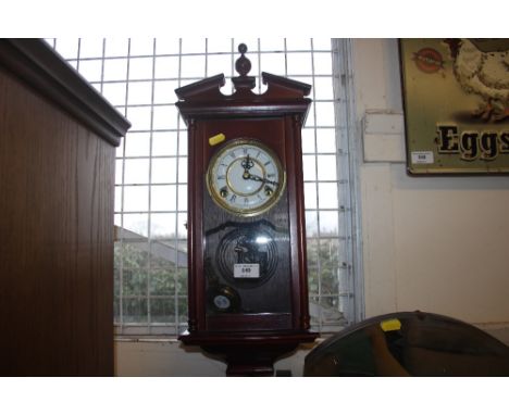 A two hole wall clock