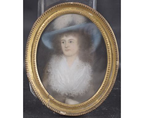 ATTRIBUTED TO SIR THOMAS LAWRENCE Portrait of a lady wearing a blue hat, pastel, in oval frame inscribed 'Early pastel by Sir
