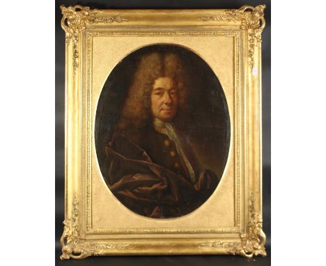 18TH CENTURY FRENCH SCHOOL A portrait of a gentleman with a fine lace shirt, oil on canvas. 30" x 23.5" (76 x 60cm) oval.