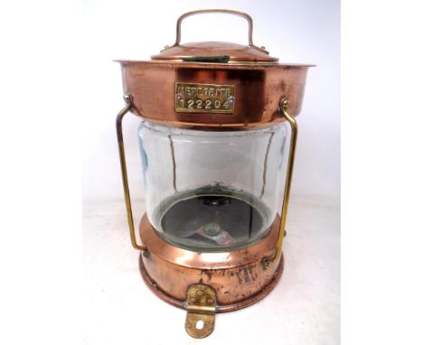 An antique copper and brass Meteorite Anchor ships lamp.