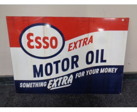 A reproduction Esso motor oil sign.