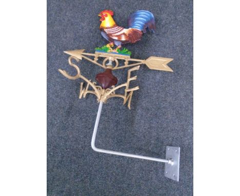 A cast iron cockerel weather vane with will mount.