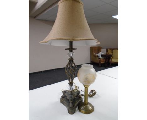 A brass table lamp with shade together with a further contemporary Art Deco style table lamp with shade.