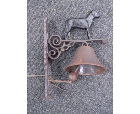 A cast iron black labrador wall bracket with bell.
