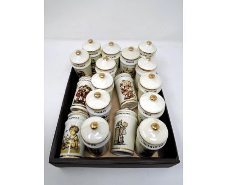 A box containing 17 Hummel lidded spice jars.