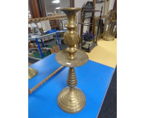 A 19th century Turkish brass candlestick (height 63cm).