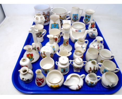 A tray containing a collection of Goss crested china together with two commemorative mugs.