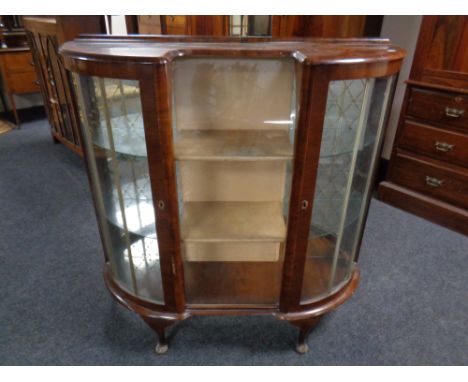 A 1930's walnut Art Deco display cabinet.