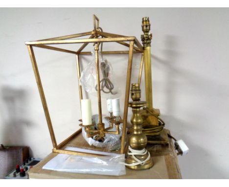 A contemporary gilt metal brass lantern light fitting together with two brass table lamps.