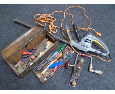 A box containing a metal toolbox containing assorted hand tools, Record woodworking plane, a Titan electric hedge trimmer.
