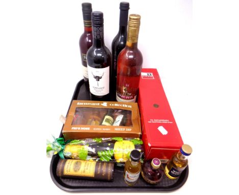 A tray containing assorted bottles of alcohol, wine and alcohol miniatures including Ouzo, Prosecco, Glenmorangie, Whyte &amp