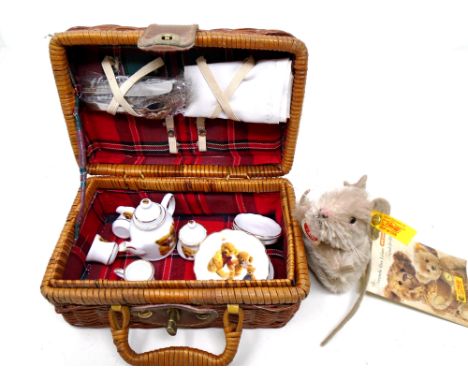 A Merrythought porcelain child's tea service in wicker basket together with a Steiff soft toy mouse, with tags.