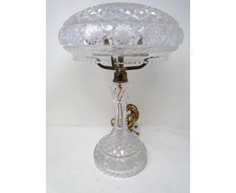 A vintage cut glass table lamp with shade.