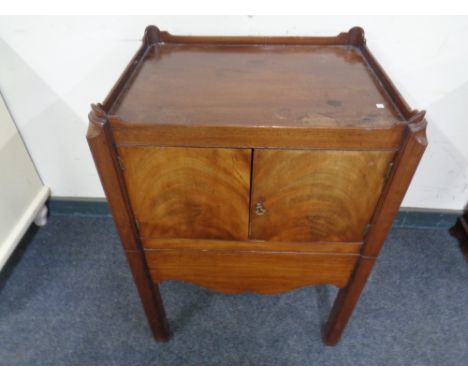 A George III mahogany double door commode cabinet.