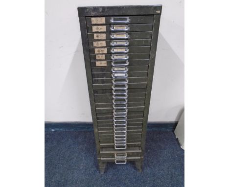 A metal 30-drawer index chest containing hardware, brass plates, fittings etc.