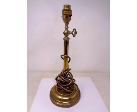 An antique brass lamp base (converted to electricity).