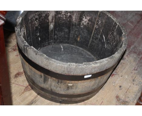 A vintage barrel garden planter. Postage unavailable dia 64cm 