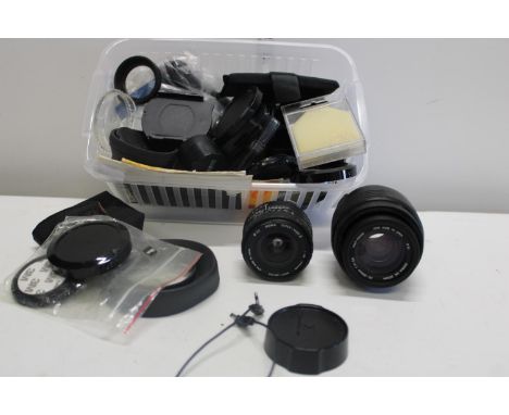 A job lot of assorted camera lenses etc 