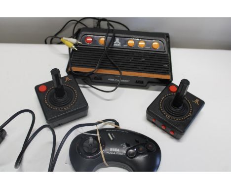 An Atari flashback game console &amp; controllers plus a Saga controller 