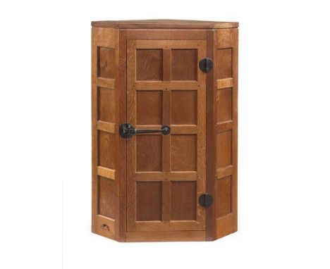 ROBERT ‘MOUSEMAN’ THOMPSON (1876-1955) CORNER CABINET, 1950's oak, with carved mouse signatureDimensions:69.2cm wide, 98cm hi