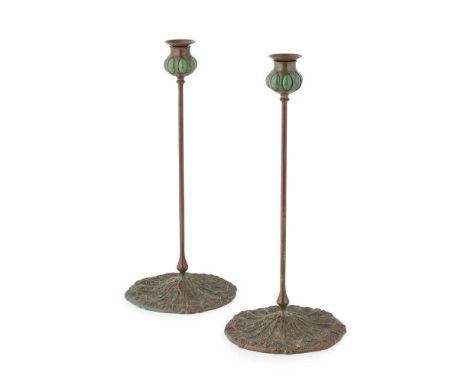 TIFFANY STUDIOS, NEW YORK PAIR OF 'QUEEN ANNE'S LACE' PATTERN TALL CANDLESTICKS, CIRCA 1900 patinated bronze, blown glass, st