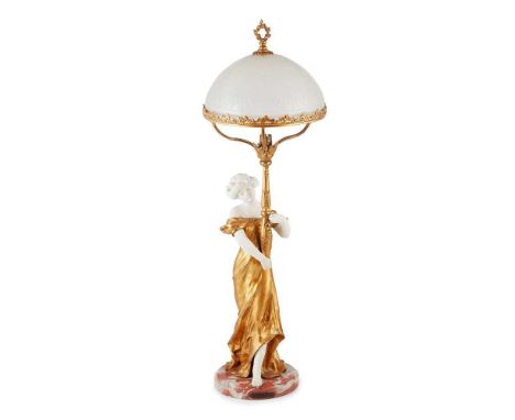 MEDNAT FIGURAL LAMP, CIRCA 1900 gilt metal, bisque porcelain, cut and frosted glass, raised on a marble plinth, signed MEDNAT