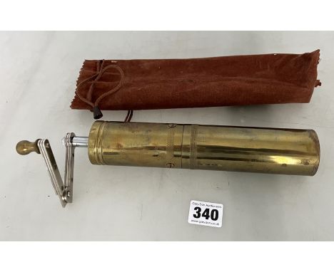 Brass grinder in velvet case