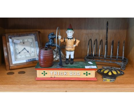 Reproduction cold painted cast iron novelty 'Trick Dog' money box, to/w ep toast rack, chrome and enamel AA badge and Art Dec