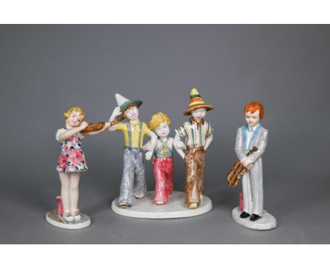 A Goldscheider with Myott Son &amp; Co. pottery group of three boys striding, 23 cm high, to/w two other figures from the sam