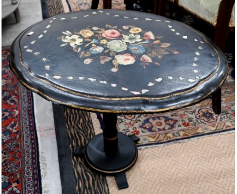 A Victorian papier maché tilt-top table with polychrome floral and mother of pearl decoration 