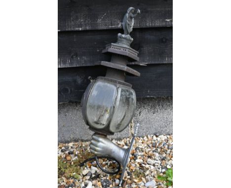 Antique metal large coach-lamp, surmounted by a cast angel on crown, the shade with foliate-etched glass panels, on 'grasped 